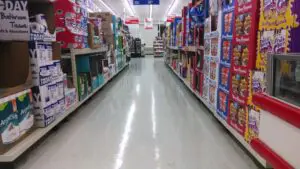 A store aisle with many boxes of toys.